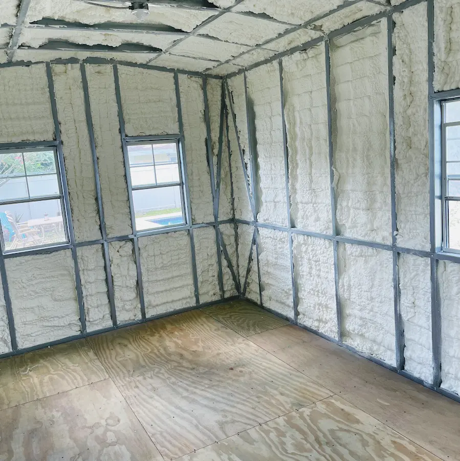 Closed-cell spray foam insulation applied to wall cavities in a residential project in Yarmouth